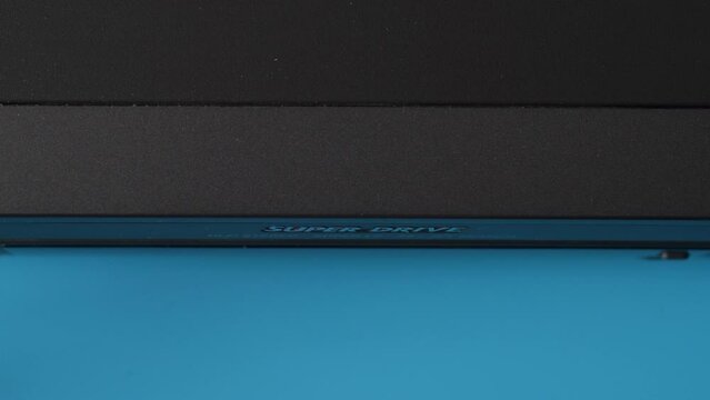 a video cassette with the inscription porn is inserted into the video player close-up. content adult films recorded on vintage video cassettes.