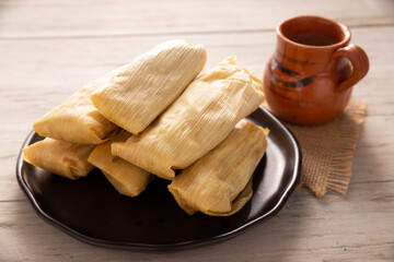 Tamales. Prehispanic dish typical of Mexico and some Latin American countries. Corn dough wrapped in corn leaves. The tamales are steamed.