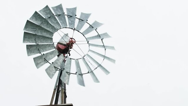 Vintage Windmill in Action: Low-Angle Shot