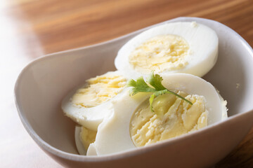 Closeup of boiled egg in bowl
