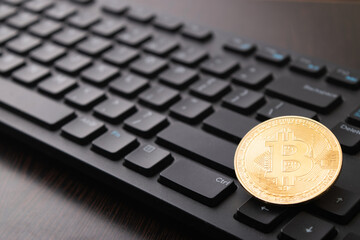 Bitcoin on keyboard, cryptocurrency concept