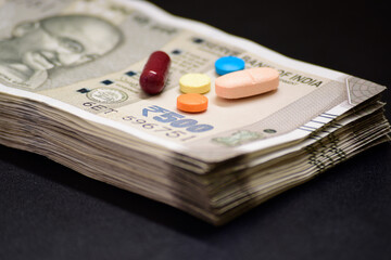 Medicine with indian currency, pharmacy business and costly medicine concept
