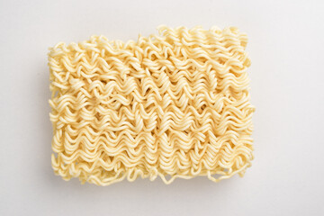 Top view of raw instant noodle on white background