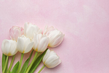 Bouquet of pink tulips on pink background.