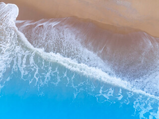 Fototapeta na wymiar The tropical Summer with Soft blue ocean wave on fine sandy beach background