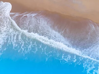 Deurstickers The tropical Summer with  Soft blue ocean wave on fine sandy beach  background © SASITHORN