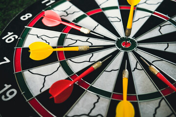 Winner yellow dart arrow hit center target of dartboard and other arrow loser metaphor marketing...