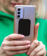 Smartphone in the girl's hand.