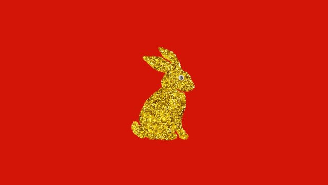 Golden rabbit made of rhinestones appears and disappears on red background as a symbol of 2023 year. Looping stop motion animation video.