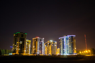 Fototapeta na wymiar View of the new buildings of Obninsk at night, Russia