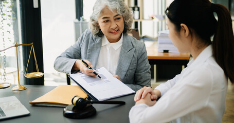 Obraz premium Business and Male lawyer or judge consult having team meeting with client, Law and Legal services concept.Customer service good cooperation