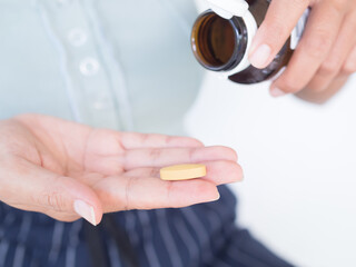 Hand Women holding Vitamin C,Supplement Mdical Pharmacy for Healthy and Beatiful,Medication Pill...