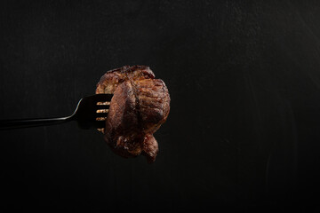 Naklejka premium The juicy steak was cooked to perfection and tasted absolutely tasty, making it one of the best meat dishes I've had.