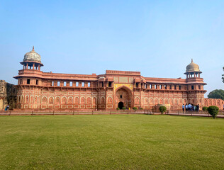 The famous red fort in the city of Agra, India. Tourists visit a popular tourist attraction.