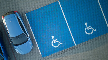 Outdoor car parking with handicapped symbol icon. Parking places reserved for disabled person....