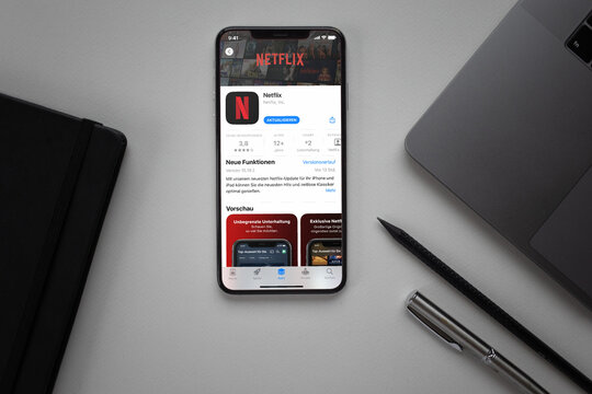 Mobile phone with Netflix App Store screen