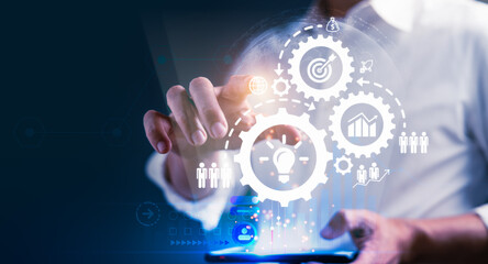 Businessman is connecting online network on virtual business icons for planning marketing target