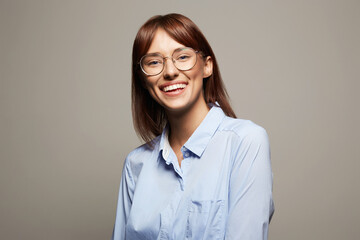 Funny Smiling Happy Girl in glasses. Beautiful laughing Woman