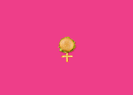 Women's day March 8 women's day symbol by burgers and French fries. Holiday restaurant women's day concept with the burger. burger on 8 shapes isolated on Pink color background.