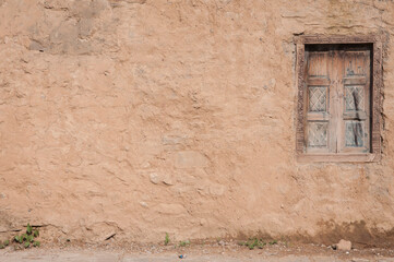 Mud wall with a window on the side Saidpur Village Islamabad Pakistan