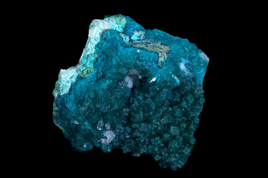 Dioptase is an intense emerald-green to bluish-green copper cyclosilicate mineral, transparent to translucent. Isolated in black background.