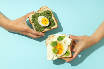 Concept of tasty breakfast with delicious food on blue background