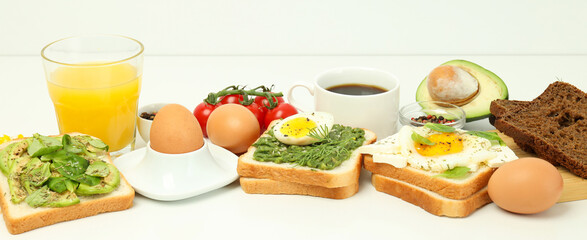 Concept of tasty breakfast with delicious food on white table