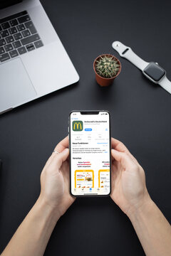Mobile phone with McDonalds App Store screen