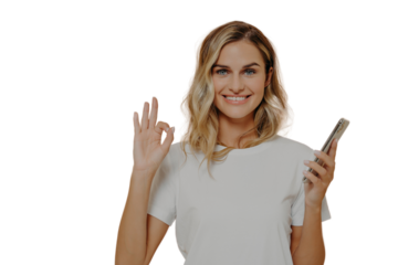 Happy cheerful female holding smartphone and showing okay gesture, being happy after pleasant conversation