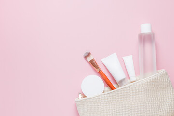Set of cosmetic products for face care in white color on a pink background. Beauty. Self care. Moisturizing the skin of the face. Cream, face mask, toner. Place for text.