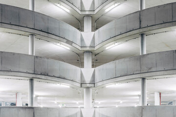 Illuminated parking garage concrete structure at night