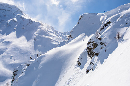 Freeride skiing on a powder day in Simplonpass, Switzerland.