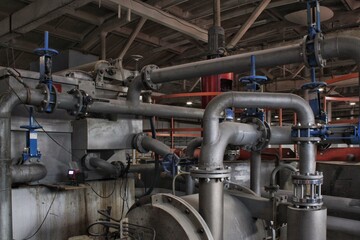 Steel pipes, tubes, steam turbine, valves, machinery, cables of modern factory. Gas boiler room of industrial zone power plant. Pump engineering station. Technical equipment system. Energy concept.