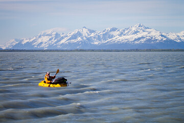 Man packrafting in Alaska