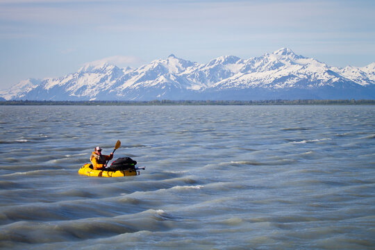 Man packrafting in Alaska