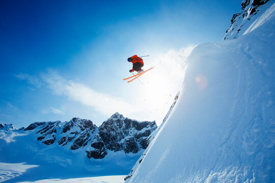 Extreme skier in mid-air after jump, Neacola Mountains, Alaska, USA