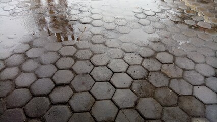floor outside the house made of hexagon shaped cement bricks