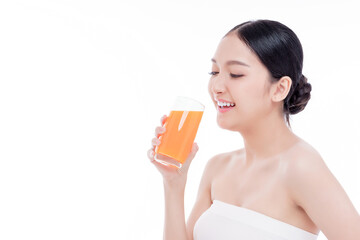 Portrait of Beautiful young woman holding orange juicy and smile isolated on white background.