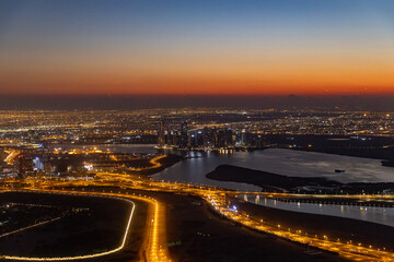 Fototapeta na wymiar city skyline at sunrise of dubai from the burj khalifa