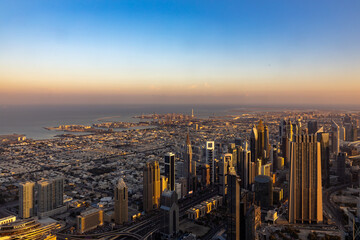 Fototapeta premium city skyline at sunrise of dubai from the burj khalifa