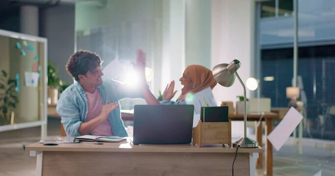 Business people, teamwork success and throw paper in finance office with laptop for review results. Man and muslim woman high five to celebrate growth, development and sales or profit with documents