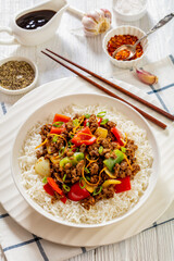 crispy ground beef with stir-fried veggies in bowl