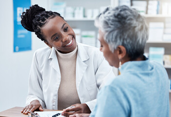 Pharmacy, healthcare or medical with a customer and black woman pharmacist in a dispensary. Medical, insurance and trust with a female medicine professional helping a patient in a drugstore