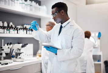 Science, research and black man test tube and tablet for medical analysis and innovation in laboratory. Pharmaceutical analytics, medicine study and scientist in South Africa checking vaccine results - obrazy, fototapety, plakaty