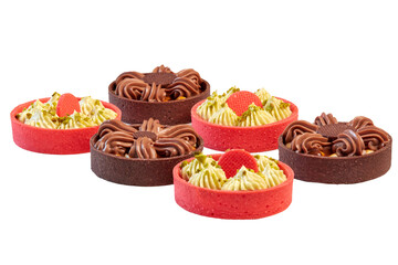 Sweet dessert: Tarts, Tartlets. An assortment of bright red baskets and dark brown ones with a sweet filling of cream and a variety of nuts. Close-up