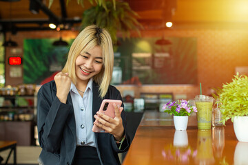 The determined beautiful business girl spoke confidently into her phone, closing yet another successful deal.