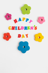 Fototapeta premium Happy Children's Day Colorful text, flowers