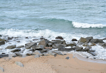 Fototapeta na wymiar Waves crashing with the rocks. Nature background, sea.