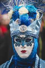 Masked person at venetian carnival