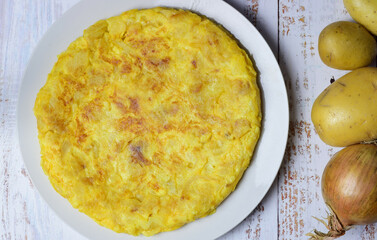 Homemade potato and onion omelet, typical of Spain. Zenith view.	